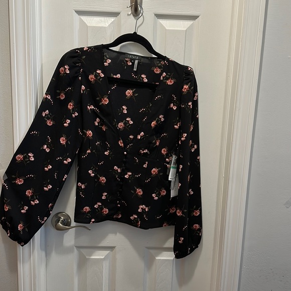 1. State Tops - Women’s top never worn 100% polyester.